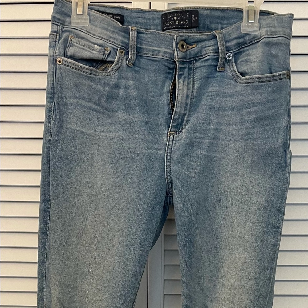 Good condition Lucky Brand distressed jeans, light blue wash, Size 12, 31 inseam